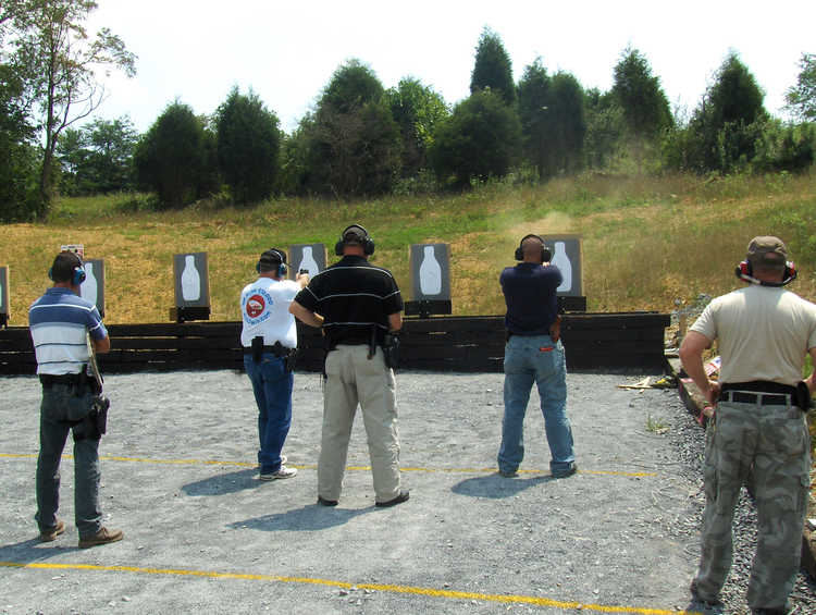 Shooters training for basic qualification at ATS Targets FLEXI BQ-90 outdoor shooting range with turning target system